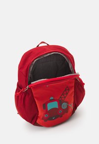 Red children's backpack with a fire truck design, featuring a zippered compartment and a plush texture, designed for storage and play.