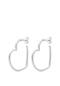 Silver hoop earrings in a heart shape with smooth, polished texture and simple stud back fastening.