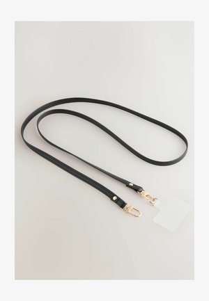 Must värvi nahkrihm sileda tekstuuriga, millel on kuldse tooni metallklambrid ja väike eemaldatav silt. Elegantne ja minimalistlik disain.