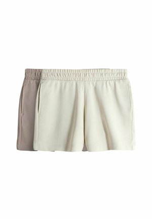 Divi šortus pāri: viens gaiši bēšs un otrs krēmkrāsas. Abiem ir elastīga josta un sānu kabatas, izgatavoti no mīkstas auduma ar gludu tekstūru.