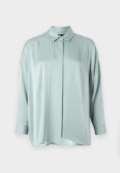 Light green satin blouse with a collared neckline, button front, and long sleeves. Features a relaxed fit and smooth texture.