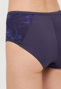 Purple hipster-style panties with floral lace accents in darker blue on the sides. Smooth fabric and a soft waistband for comfort.