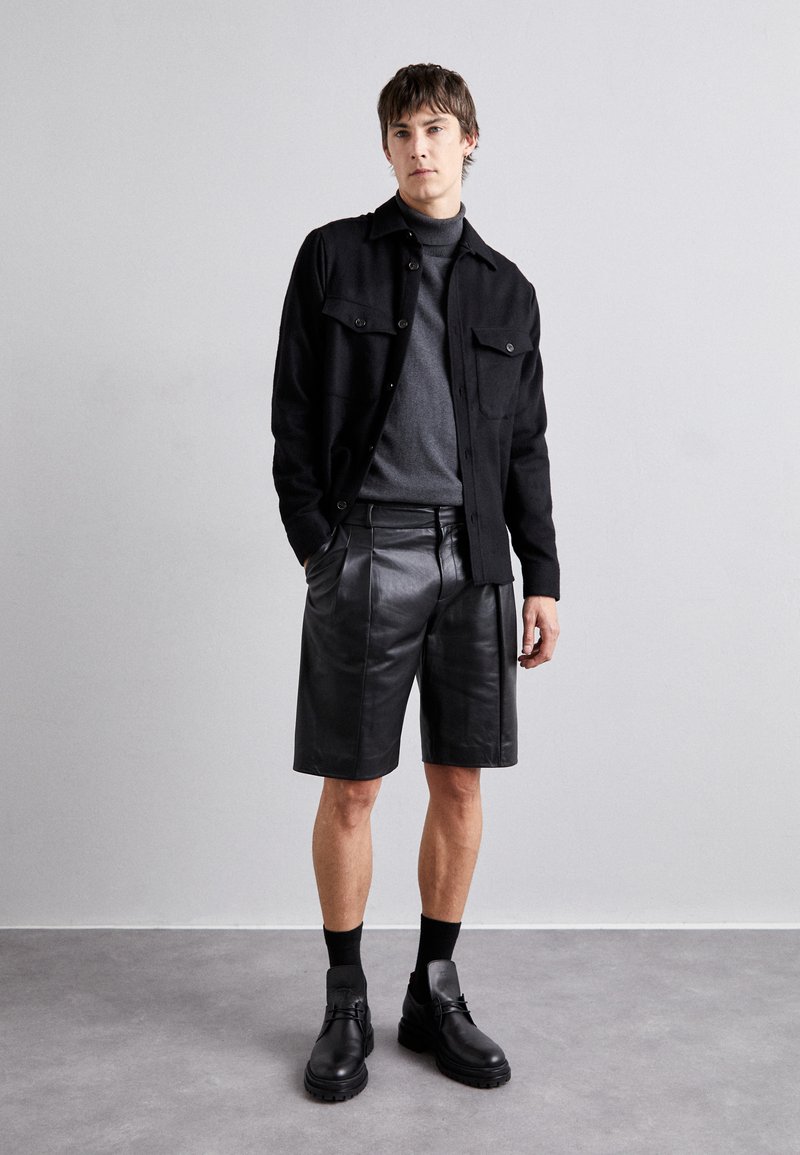 STUDIO ID BOB - Leather trousers - black - Zalando.co.uk