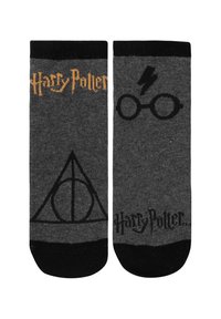 Black and gray socks featuring printed Harry Potter text, a lightning bolt, glasses, and the Deathly Hallows symbol. Cotton blend material.