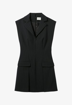 Blazer sans manches noir à rayures, avec un col cranté, deux poches avant et une fermeture éclair dissimulée au dos. Design ajusté.
