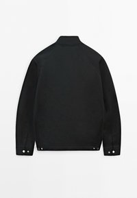 Black long-sleeve jacket with a stand collar, snap button cuffs, and snap button details at the hem, shown from the back on a white background.