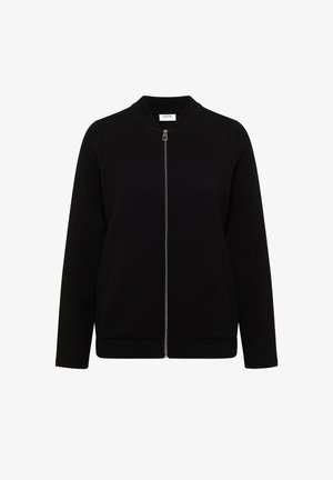 Giacca nera a maniche lunghe con cerniera frontale e orlo elastico, caratterizzata da un colletto rotondo e un'etichetta "CECIL" all'interno della scollatura.