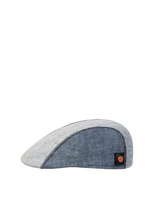 Flat, two-tone flat cap with light gray front and dark blue side panels, featuring a brown round brand logo patch on the side.