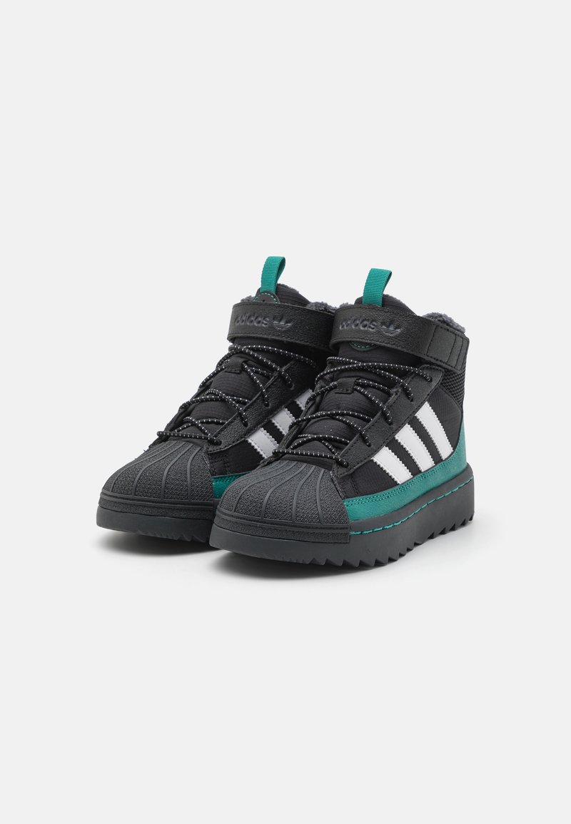 adidas Originals SUPERSTAR UNISEX - Winter boots - core black/footwear  white/active green/black - Zalando.co.uk