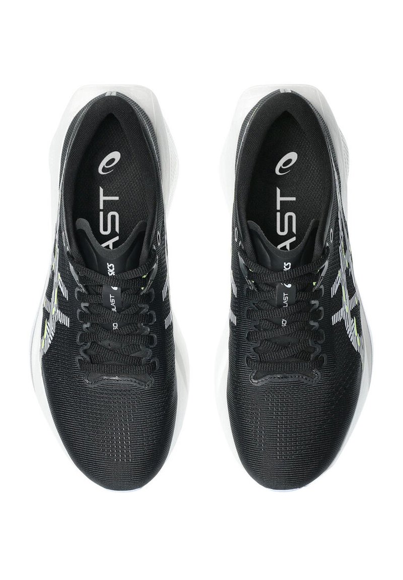 Black athletic shoes with a textured upper, reflective accents, and white detailing. Features black laces and a cushioned sole.