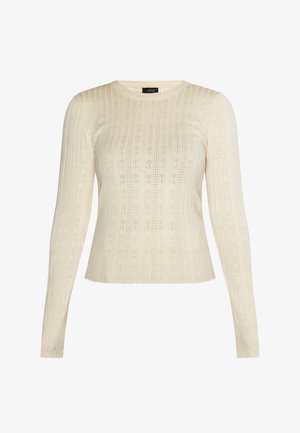 Maglione a maniche lunghe color crema con una texture a coste e un motivo a maglia aperta. Presenta un collo a giro e una silhouette aderente.