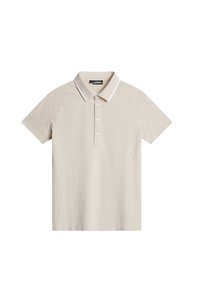 Kortärmad pikétröja i ljusbeige med ett texturerat mönster på axlarna, vit krage och placket med fem knappar.