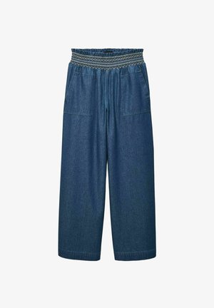 Culottes en denim à jambes larges, taille smockée élastique et deux poches avant. Le tissu est d'un bleu moyen avec une texture lisse.