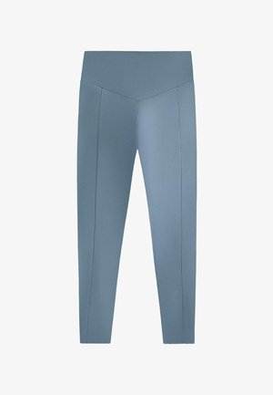 Blue leggings made of smooth, stretchy fabric. They feature a high waistband and seam details along the legs. No patterns or accents.