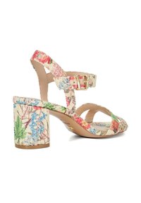 Floral patterned heeled sandal featuring a beige base, thin straps, buckle closure, and a block heel. Material appears textured.