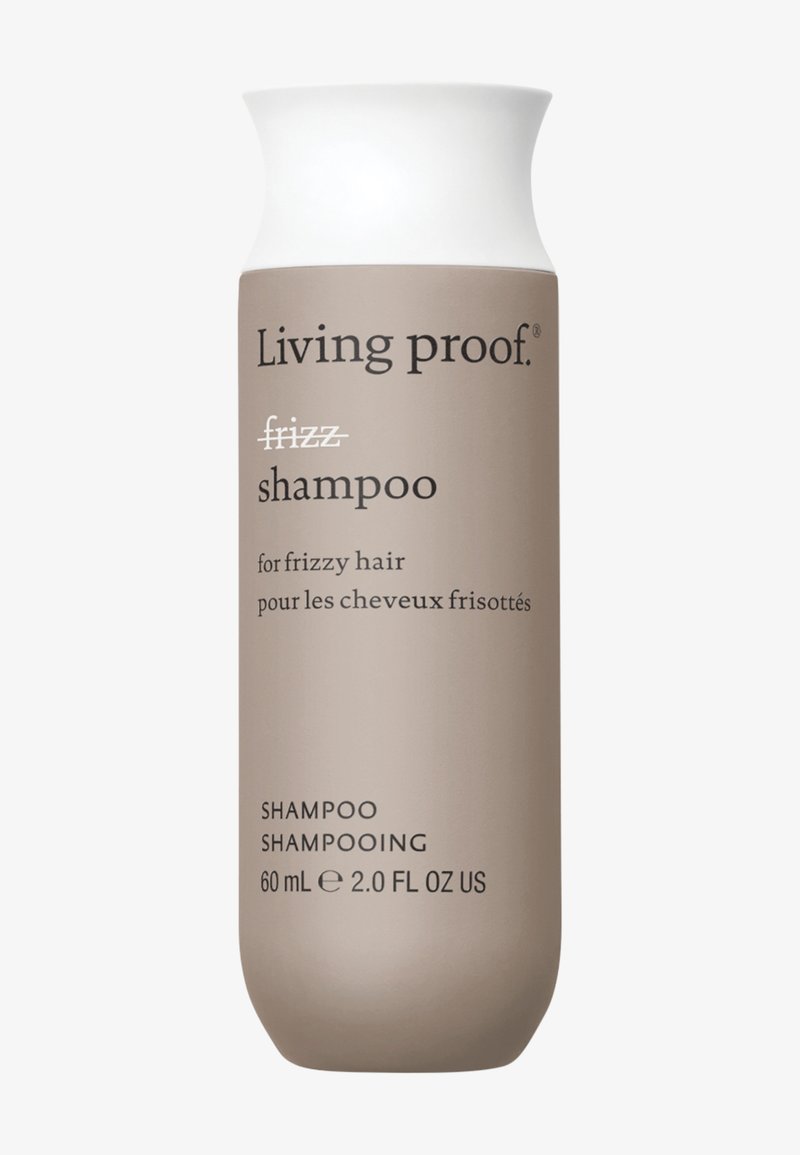 Flacon de shampooing Living Proof pour cheveux frisés, beige avec bouchon blanc, taille 60 ml (2,0 fl oz), texte bilingue en anglais et en français.