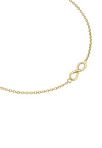 Zelta ķēdes aproce ar bezgalības simbola piekare, smalkām saitēm, gludu tekstūru un minimālisma dizainu.