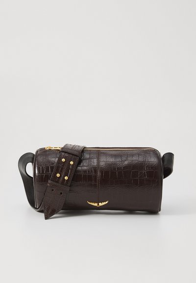 Brown crocodile-embossed leather bag with a cylindrical shape, gold-tone hardware, and a detachable strap featuring studs.