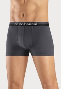 Donkergrijze boxershorts gemaakt van zacht materiaal met een zwarte, gebrandmerkte elastische tailleband. Heeft een aansluitend ontwerp en platte naden.