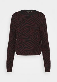 Pulovr svetr v burgundské a černé zebrované vzoru, vyrobený z pleteného materiálu, s dlouhými rukávy a kulatým výstřihem, krátký střih.