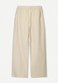 Pantaloni larghi in lino beige con vita elastica e tasche laterali, caratterizzati da una superficie liscia e dettagli di cucitura minimi.