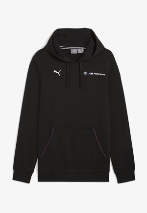 Musta kapuutsiga dressipluus, mis on valmistatud pehmest kangast. Omab reguleeritavat kapuutsi, eesmist taskut, millel on värviline äär ning valged logod Puma ja BMW Motorsport.