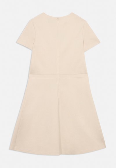 Beige short-sleeve dress with a concealed back zipper, waist seam, and A-line skirt, laid flat on a light background.