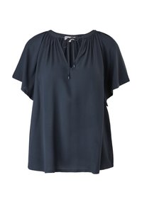 Blouse bleu marine avec des manches courtes et flottantes, un décolleté en V et un lien à resserrer. Le tissu texturé apporte un intérêt visuel subtil.