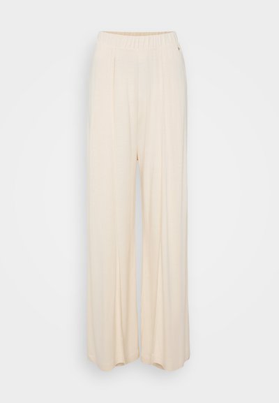 Weite, cremefarbene Hosen mit elastischem Bund und Falten an der Vorderseite. Weiche Textur und glatte Oberfläche durchgängig.
