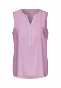 Blusa senza maniche di colore rosa con scollatura a V, due tasche sul petto e finitura in tessuto morbido. Presenta un orlo arrotondato per un fit rilassato.