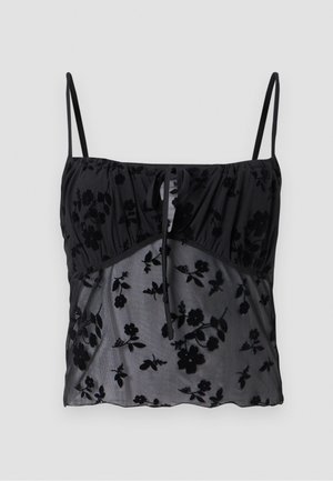 Sort cami-top med tynde stropper, prydet med et blomsterdesign. Fremstillet af gennemskinneligt stof med mørkere blomstertexturer, samlet ved busten med en bindedetalje.