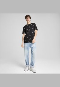 Puma POWER - Marškinėliai su spaudiniu - black