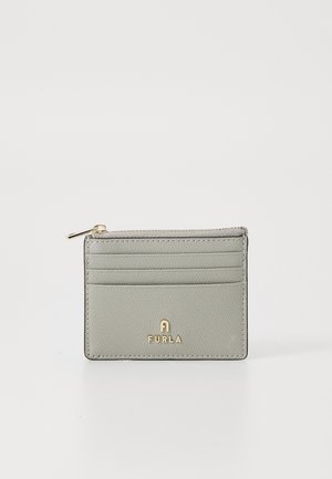 Furla cardholder in light gray textured leather with gold-tone hardware, featuring multiple card slots and a zippered compartment.