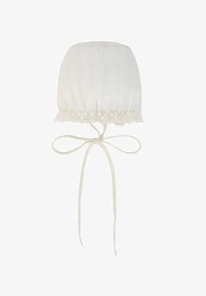 White cotton bonnet with vertical ribbing, lace trim at the bottom, and adjustable ties for securing under the chin. Textured, soft fabric.