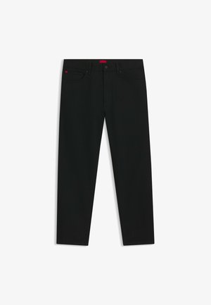 Schwarze Jeans mit klassischer Passform. Aus Denim mit glatter Textur gefertigt. Auffälliges rotes Logo-Tag am Bund. Minimalistisches Design.