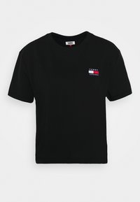 Zwarte cropped t-shirt van katoen. Beschikt over korte mouwen, een ronde halslijn en een meerkleurig geborduurd logo aan de bovenlinkerkant.