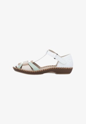 Sandale à lanières en blanc, beige et vert menthe. Fabriquée en matériaux syntétiques, elle possède un petit talon et une semelle marron cousue. Bride de cheville réglable.