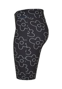 Fekete leggings, nagy fehér virágmintázattal, rugalmas anyagból, magas derékvonallal és sima textúrával. Oldalsó varrás látható.