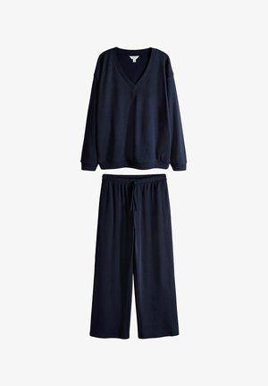 Set de loungewear albastru marin, format din bluză cu mânecă lungă și decolteu în V și pantaloni evazați cu talie cu șnur, țesătură moale.