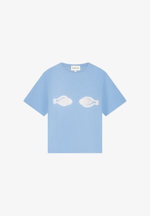 Light blue short-sleeve t-shirt with two white fish-shaped cutout patterns centered on the chest.