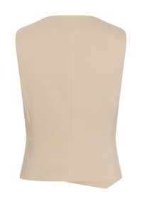 Béžový bezrukávový top s přiléhavým střihem, který má hladkou strukturu, čisté linie a asymetrický lem vzadu.