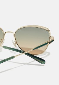 COACH Päikeseprillid - shiny light gold-coloured/pine tree/green champagne gradient