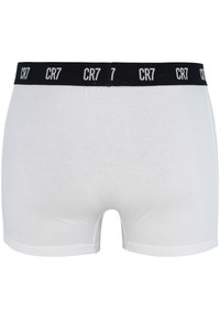 Witte katoenen boxershorts met een zwarte elastische tailleband met het "CR7" logo patroon. Gladde textuur, aansluitend ontwerp en gemiddeld lange pasvorm.