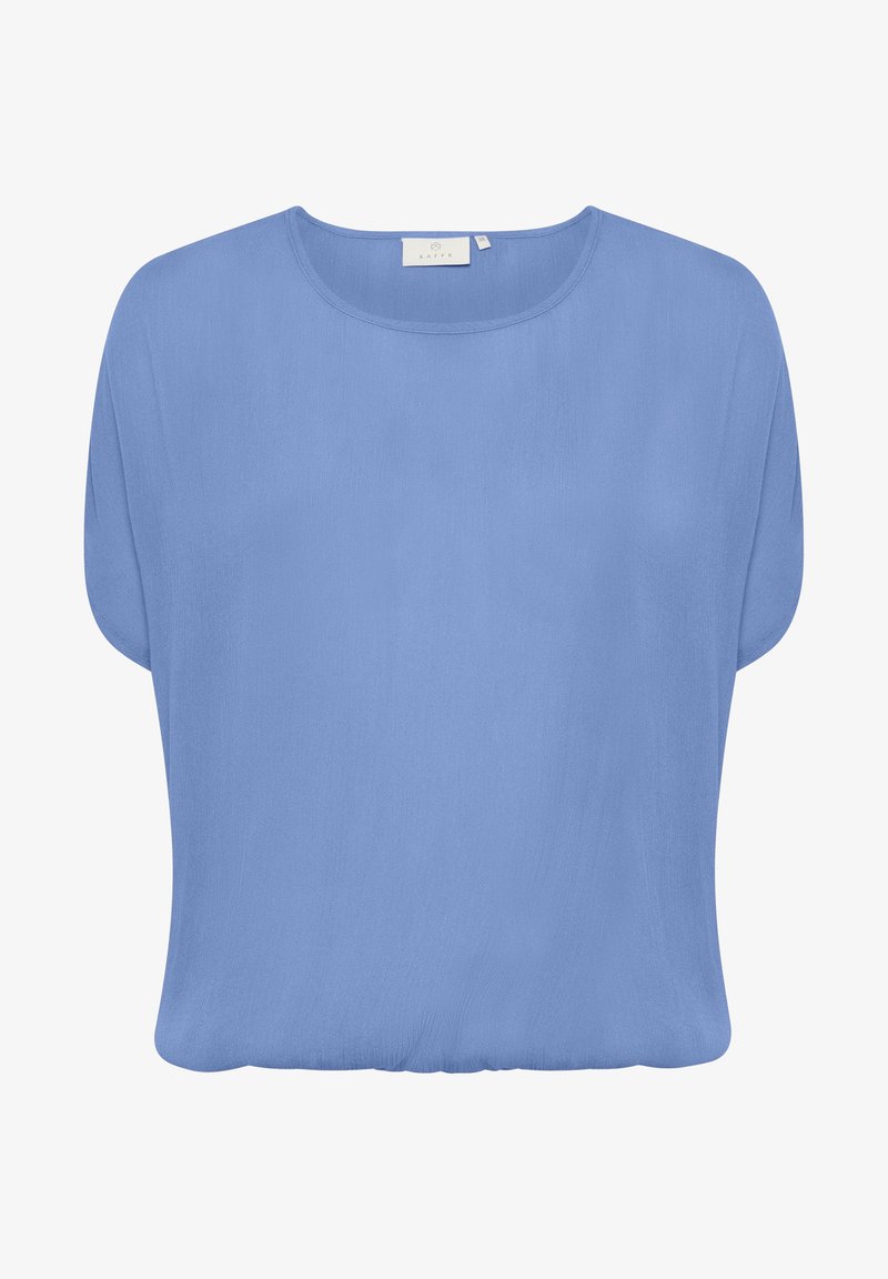 Blouse bleu clair à manches courtes avec un col rond et un ourlet ample légèrement froncé, confectionnée dans un tissu léger.