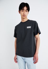 Levi's® VINTAGE FIT GRAPHIC - Nyomott mintás póló - pirate black