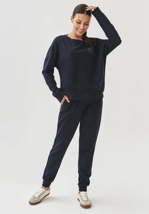 TATUUM SENTI - Tracksuit bottoms - navy