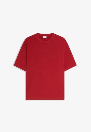 Tricou roșu cu mâneci scurte și guler rotund, croială lejeră, prezentat întins pe un fundal alb.