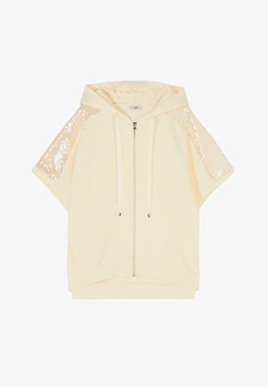Cream short-sleeve hoodie with front zipper and drawstrings, featuring sequined panels on the sleeves.