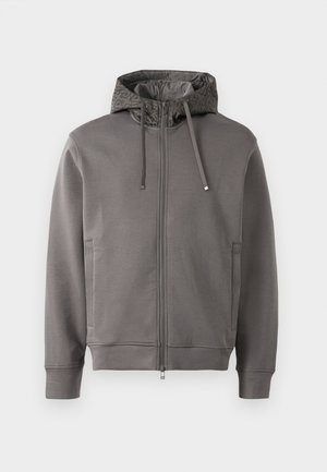 Grauer Zip-Hoodie mit einer strukturierten Kapuzenfutter, Zugbändern und Seitentaschen. Mit gerippten Bündchen und Saum für eine enge Passform.