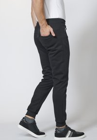 Koroshi JOGGING  - Tepláky - black
